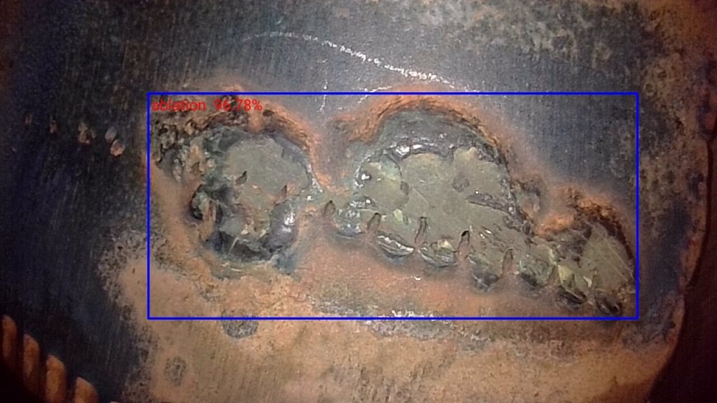Yateks Realta 3D industrial endoscope aviation inspection image showing aircraft component ablation wear with AI defect marking