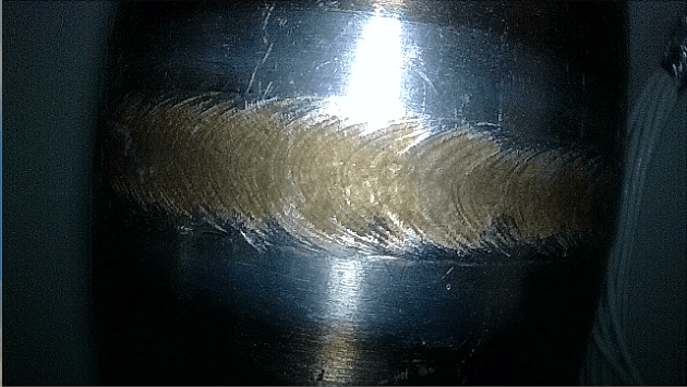 Close-up metal scratch inspection captured by Yateks narrow FOV endoscope with shallow DOF for micro flaw detection